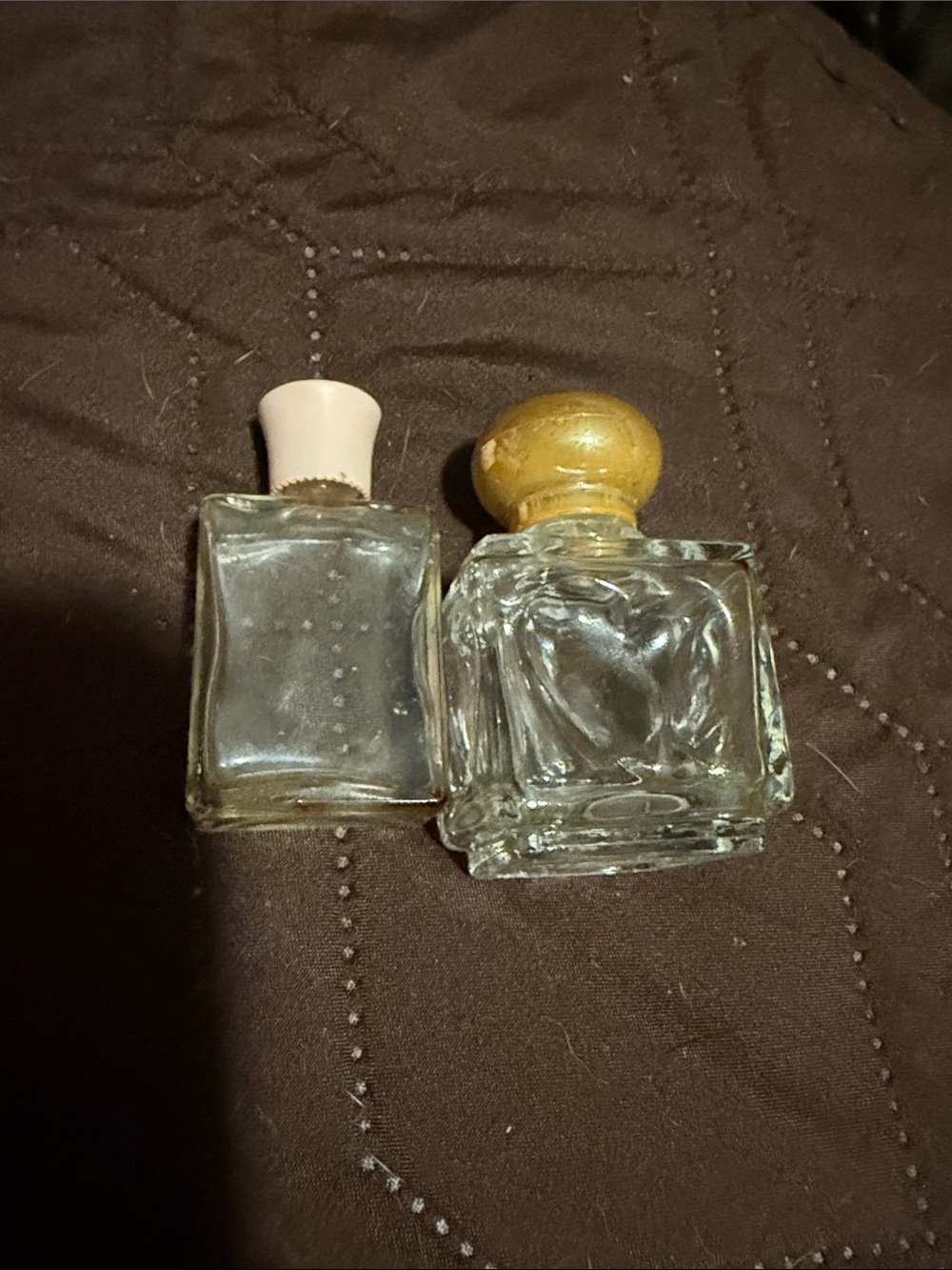 Set of Two Clear Glass Vanity Bottles with Cream and Gold Caps